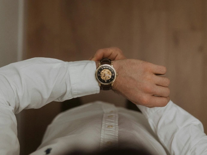 person wearing silver and black analog watch